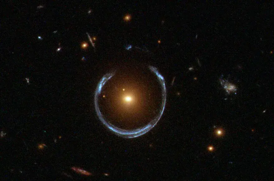 The Cosmic Horseshoe, a near-complete blue Einstein ring of a distant galaxy lensed around a massive foreground galaxy